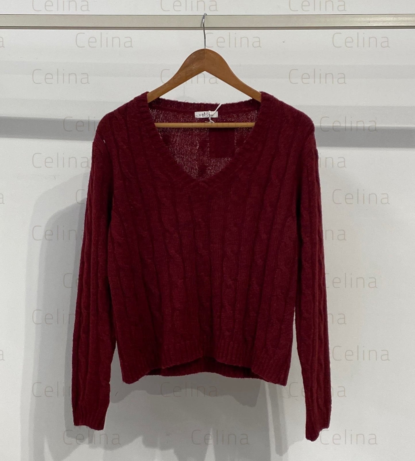 Jersey punto cuello pico detalle nudo